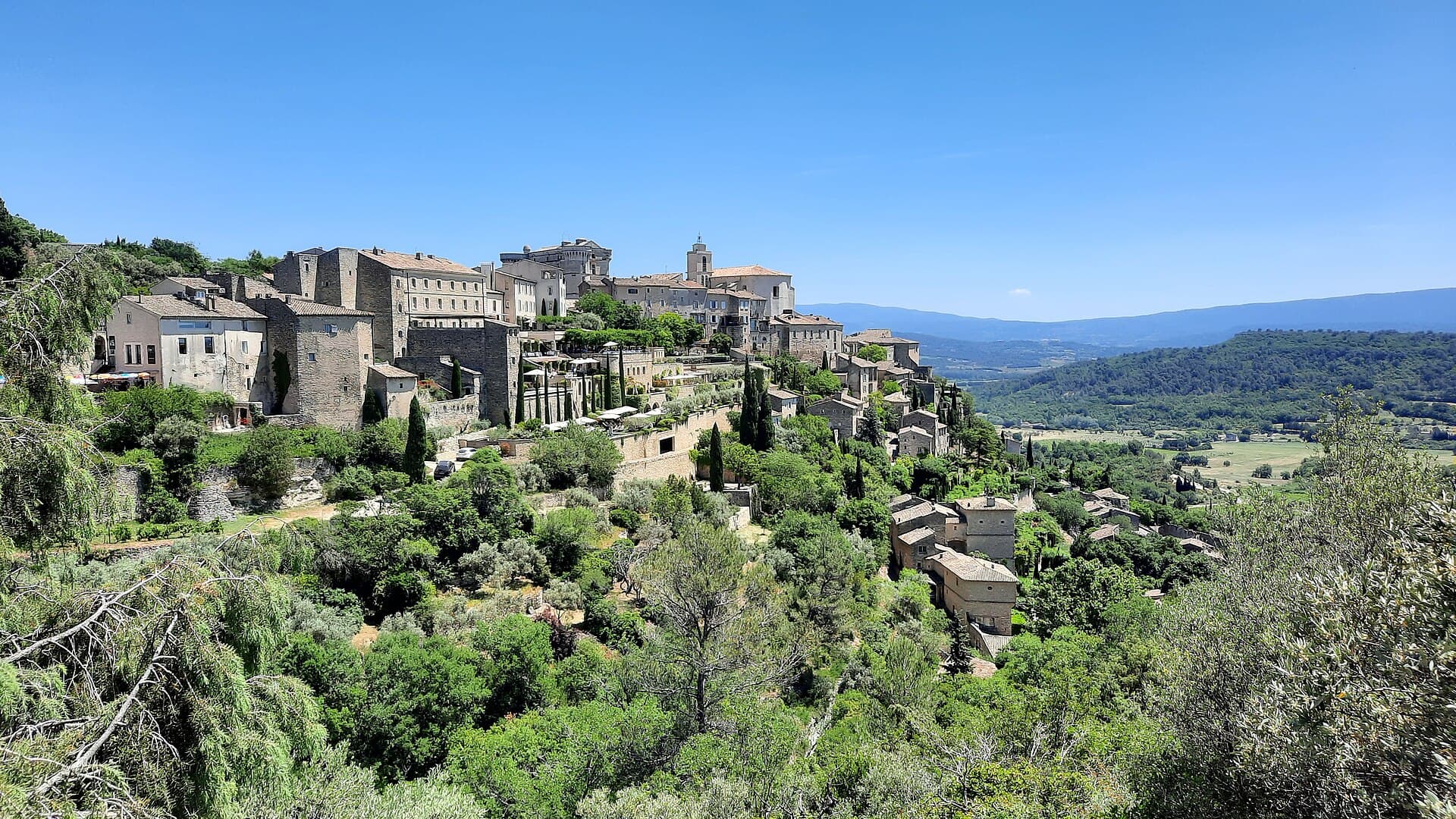 The hill village of Gordes seen across the valley